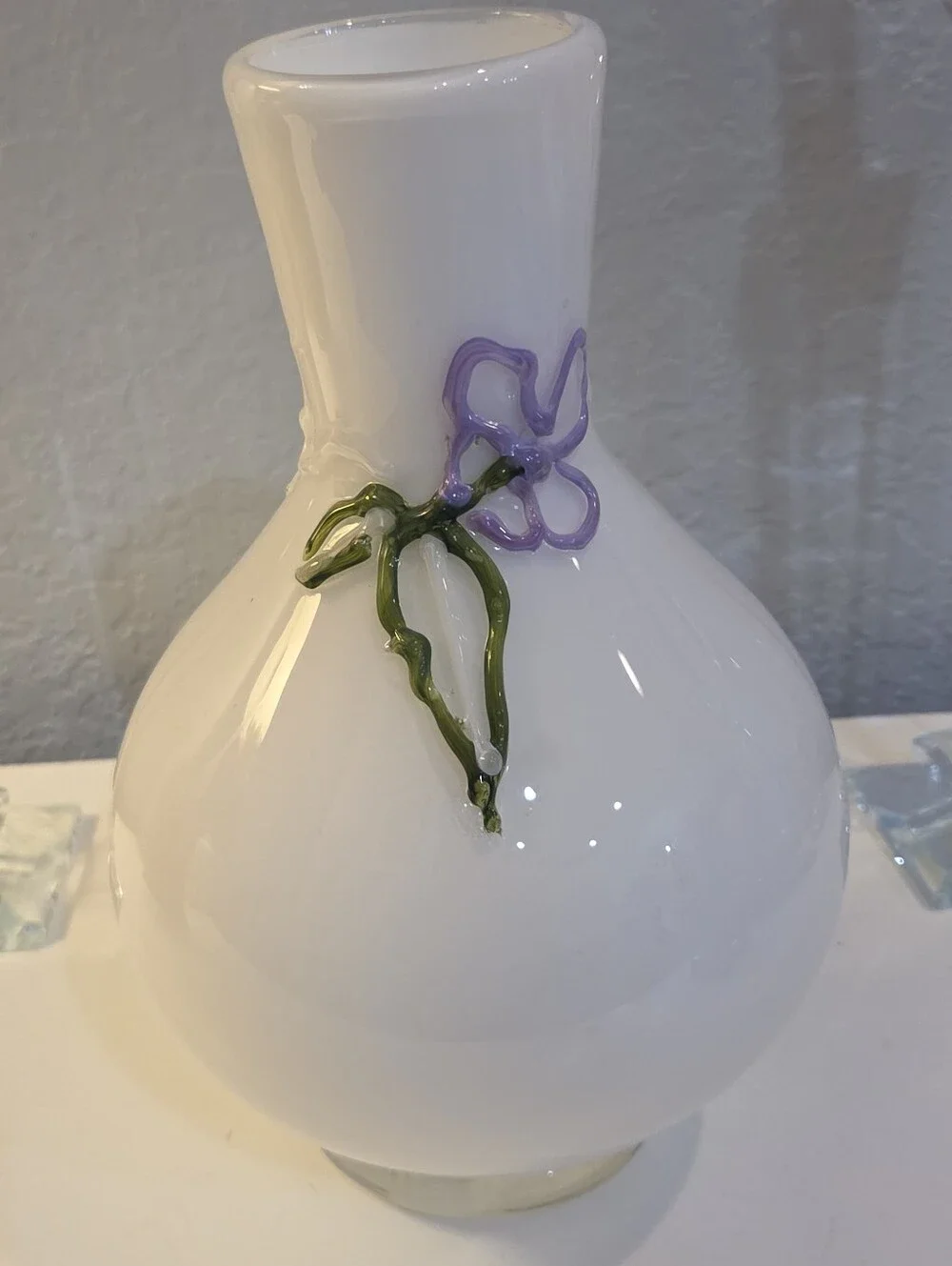 White Glass Vase With Raised Delicate Purple Flowers And Green Vines